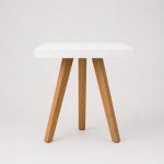 White and wood tripod cocktail table